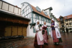 Colorful Lithuanian national costumes with intricately embroidered aprons. Photo credit: Peter Guttman