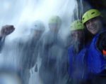 MIR travelers hike under a waterfall in Croatia. Photo credit: Iris Adventures