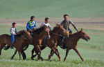 Young Mongolians on horseback. Photo credit: Helge Pedersen.