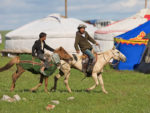 Horsemanship from generation to generation at Mongolia's Naadam Festival in Ulaanbaatar. Photo credit: Helge Pedersen