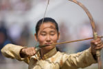 Taking aim in archery competition at Mongolia’s Naadam Festival. Photo credit: Helge Pedersen