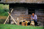A Latvian artisan carves wood, a skill handed down from generation to generation. Photo credit: Peter Guttman