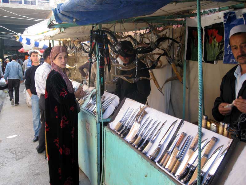 Knife sellers at Istaravshan Market. Photo credit: Jake Smith