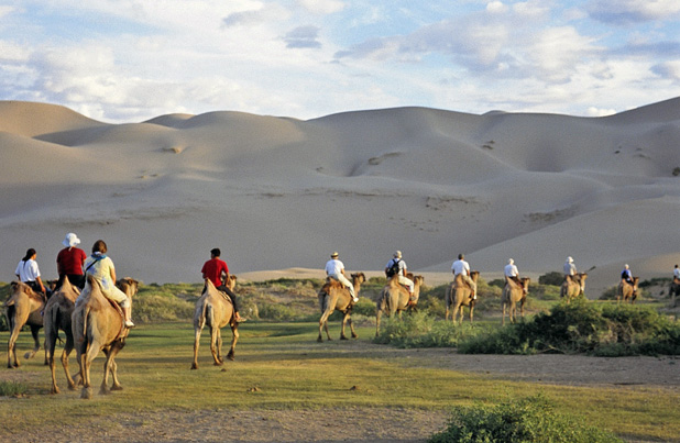 Group camel ride in Mongolia. Photo credit: Michel Behar