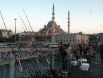 Fisherman atop the Galata Bridge, spanning Istanbul's Golden Horn.