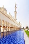 Vertical view of sheik zayed mosque in Abu Dhabi with its blue moat.
