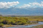 Kyrgyzstan's raw beauty, set against the Tien Shan Mountains. Photo credit: Bill Fletcher