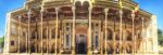 Panoramic view of the facade of the Bolo Hauz Mosque in Bukhara, featuring numerous wooden columns, intricate tilework, and a high wooden ceiling. Photo credit: Abdu Samadov