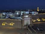 Bukhara's Ark Citadel lit up at dusk.