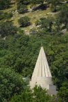 A conical Yazidi temple in the forest near Lalish.