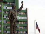 Former U.S. President Bill Clinton salutes the people of Pristina, Kosovo. Photo credit: Joanna Millick
