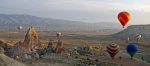 Hot-air balloonists enjoy close-up views of Cappadocia's moonscape: fairy chimneys, rock pillars, and tuff caves. Photo credit: Jered Gorman