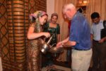 Travelers are treated as honored guests in Uzbek homes; here, an Uzbek hostess offers a special pot and basin so guests may wash their hands before the meal. Photo credit: Russ Cmolik & Ellen Cmolik