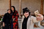 Locals snap a quick selfie, Silk Road style. Photo credit: Phil Kidd
