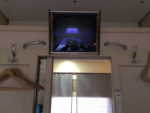 Sample First Class Cabin, video screen and sliding door to corridor. Photo credit: John Seckel