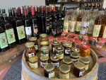Selection of jams, olive oil, wine, and rakija in Albania. Photo credit: Michel Behar