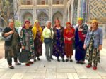 A MIR traveler makes friends at the historic Shah-i-Zinda complex in Samarkand, Uzbekistan. Photo credit: Michel Behar
