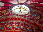 The interiors of Kyrgyz yurts burst with color and personality. Photo credit: Michel Behar