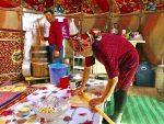 Rolling out nan, a common component of many Kyrgyz meals. Photo credit: Michel Behar