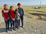 These Kyrgyz children are brimming with curiosity and friendly smiles. Photo credit: Michel Behar
