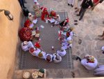Omani children sitting in a circle.