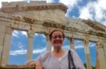 Patricia Schultz, author of 1,000 Places to See Before You Die, snaps a picture in Apollonia Archaeological Park in Albania. Photo credit: Michel Behar