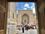 Admiring the incredible Timurid tilework at the Registan in Samarkand. Photo credit: Michel Behar