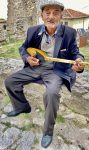 Local musician in Albania. Photo credit: Michel Behar