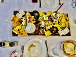 An appetizer platter of lakror, cheese, olives, and roasted vegetables during a group meal in Albania. Photo credit: Michel Behar