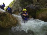 Pro tip: keep your hands across your chest (or out in front of you if you need to help with steering and balance) when sliding over rapids. Photo credit: Iris Adventures