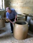 A qvevri-maker in Kutaisi, Georgia, here working on a clay oven, or tone. Photo credit: Mariana Noble