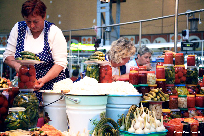 Stalls inside Bessarabsky Market are piled high with fresh produce and preserved goods (Kiev.) Photo credit: Peter Sukonik