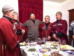 Georgian polyphonic singing over a table full of food.