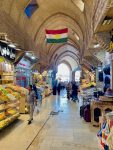 The Kurdish flag proudly flying over a walkway within Erbil's main bazaar.