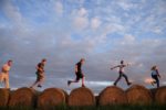 Getting a haystack workout in rural Estonia. Photo credit: Estonian Tourist Board