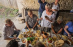 Practicing the art of toastmaking during a delicious rustic lunch at the home of a local wine maker in Koreti. Photo Credit: Kees Sprengers.