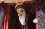 A Kyrgyz woman inside of her yurt. Photo credit: Vlad Ushakov
