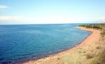 An isolated sandy beach at Lake Issyk-Kul (Kyrgyzstan). Photo credit: Vlad Ushakov