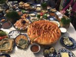 A typical Navruz table groans with special dishes made just for this holiday, including this delicious round bread. Photo credit: Abdu Samadov