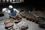 Clay artisan in Kashgar, China. Photo credit: Jake Smith