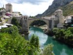 Mostar's Old Bridge connects the two parts of town, divided by the Neretva River. Photo credit: Chris Lira
