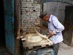 A local craftsman makes steamer baskets for sale in Old Town Kashgar. Photo credit: Martin Klimenta