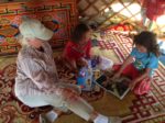 Chatting with Mongolian kids in the Gobi. Photo credit: Lori Linthicum