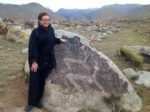 Patricia viewing the petroglyphs in Cholpan-Ata, Kyrgyzstan. Photo credit: Michel Behar