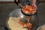 Matchstick carrots, onions, cumin, coriander, and raisins are favorite ingredients in plov, Uzbekistan's national comfort food. Photo credit: Marina Arkhipova