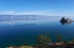 Shaman Rock and the clear blue waters of Lake Baikal in Siberia, Russia. Photo credit: Alla Shishkina