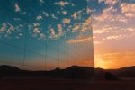 A desert sunset reflecting off the mirrored walls of the Maraya Center in Al Ula. Photo library: Saudi Tourism Authority