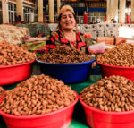 A nut vendor at Khujand’s pink-painted covered Panjshanbe Bazaar. Photo credit: Lindsay Fincher