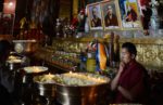 Tibetan Monk ponders. Photo credit: Phil Kidd
