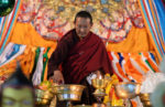 Tending the lamps in Lhasa, Tibet. Photo credit: Phil Kidd